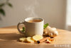 Yang-energy warming foods in TCM: dried ginger, cinnamon, and dried tangerine peel on a sunlit wooden table