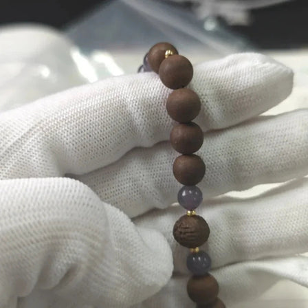 FAQ about Chinese medicine bracelets, featuring a handcrafted herbal crystal bracelet