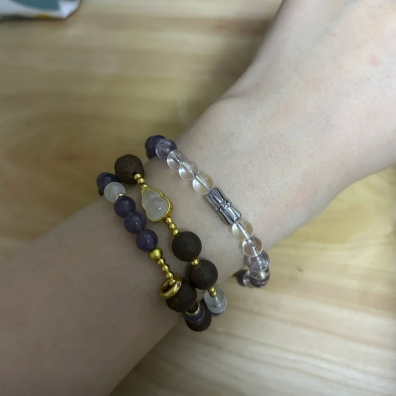 Magnolia Tranquility Bracelet by Laxne Ziyanfu displayed on a wrist, showcasing its handcrafted herbal design.